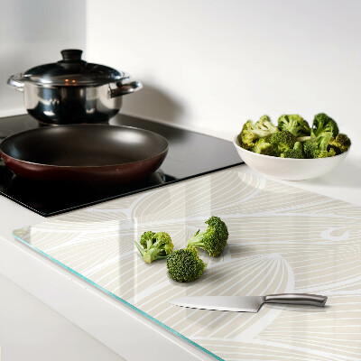 Tagliere in vetro con motivo di foglie in una grafica delicata