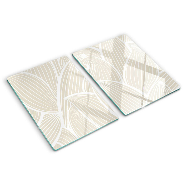 Tagliere in vetro con motivo di foglie in una grafica delicata
