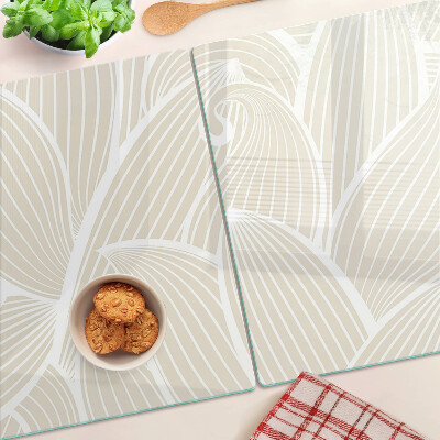 Tagliere in vetro con motivo di foglie in una grafica delicata