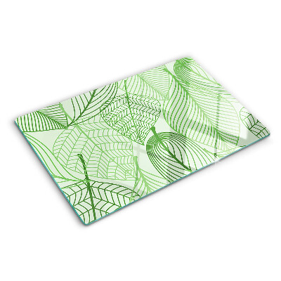 Tagliere in vetro con motivo di foglie nei toni del verde