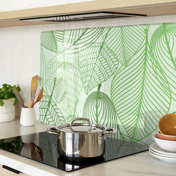 Tagliere in vetro con motivo di foglie nei toni del verde