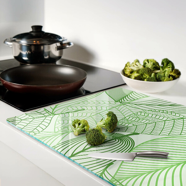 Tagliere in vetro con motivo di foglie nei toni del verde