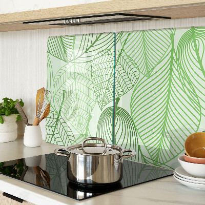 Tagliere in vetro con motivo di foglie nei toni del verde