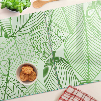 Tagliere in vetro con motivo di foglie nei toni del verde