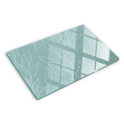 Tagliere in vetro temperato con motivo a foglie sullo sfondo