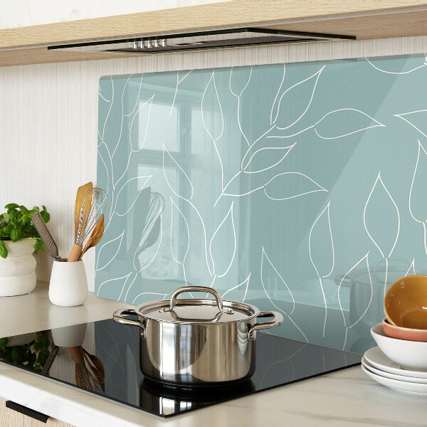 Tagliere in vetro temperato con motivo a foglie sullo sfondo