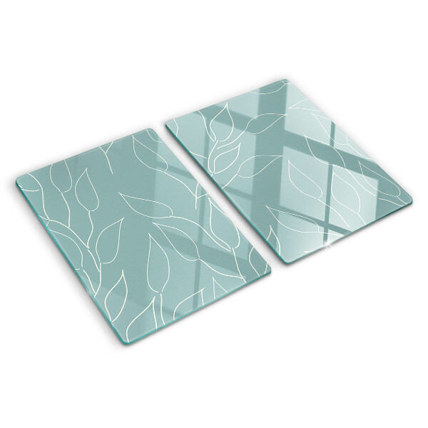 Tagliere in vetro temperato con motivo a foglie sullo sfondo