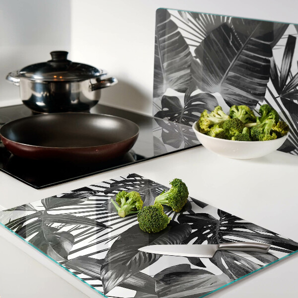 Tagliere in vetro con motivo di foglie tropicali in bianco e nero