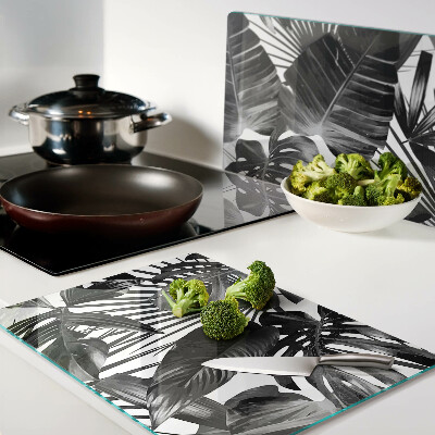 Tagliere in vetro con motivo di foglie tropicali in bianco e nero
