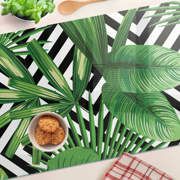 Tagliere in vetro temperato con motivi di foglie tropicali su strisce