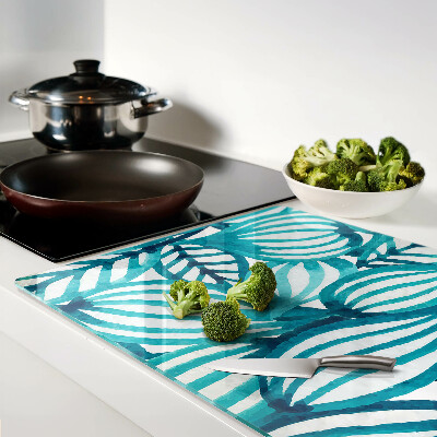 Tagliere in vetro con motivo di foglie nei toni del turchese