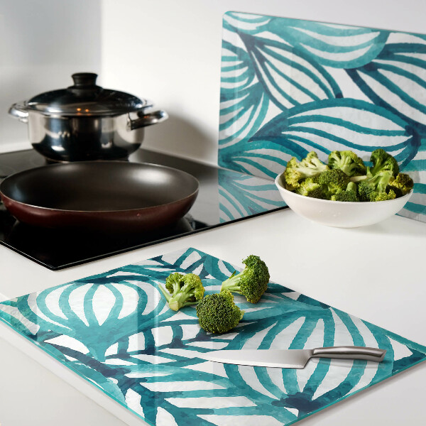 Tagliere in vetro con motivo di foglie nei toni del turchese