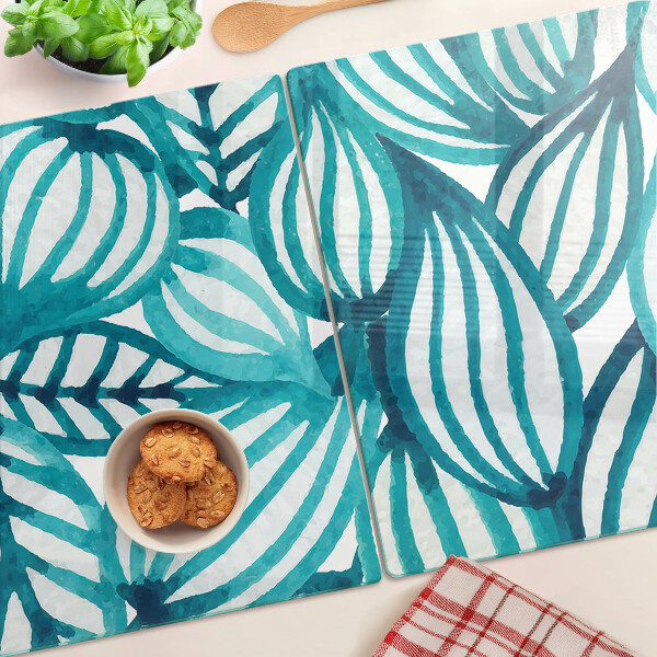 Tagliere in vetro con motivo di foglie nei toni del turchese