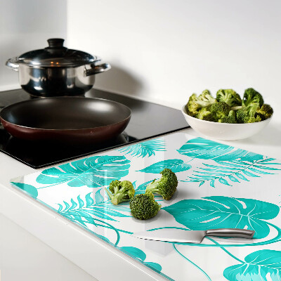 Tagliere in vetro con motivo di foglie tropicali nei toni del verde