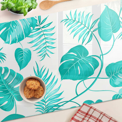 Tagliere in vetro con motivo di foglie tropicali nei toni del verde