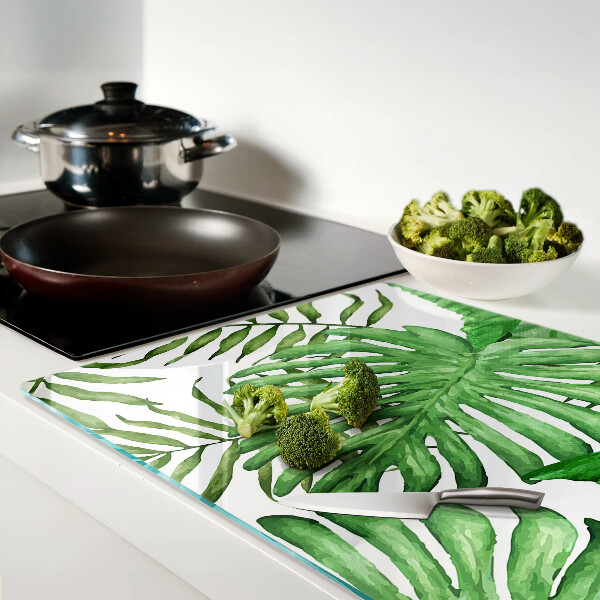 Tagliere in vetro temperato con motivo di foglie tropicali nei toni del verde