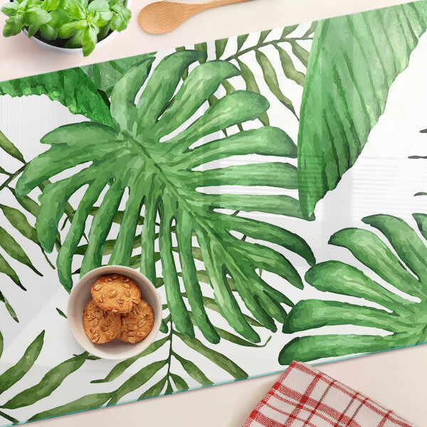 Tagliere in vetro temperato con motivo di foglie tropicali nei toni del verde