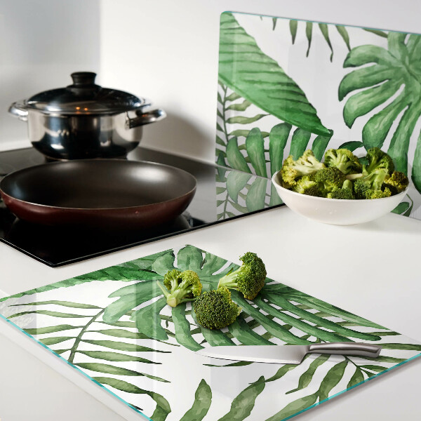 Tagliere in vetro temperato con motivo di foglie tropicali nei toni del verde