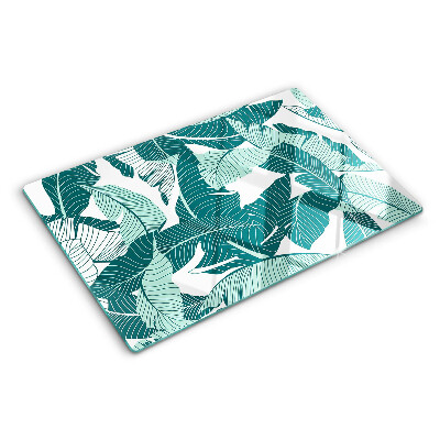 Tagliere in vetro con motivo di foglie tropicali nei toni del verde