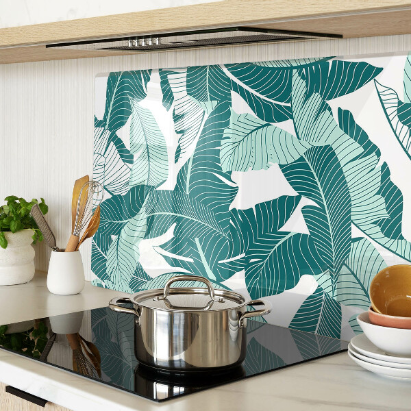 Tagliere in vetro con motivo di foglie tropicali nei toni del verde