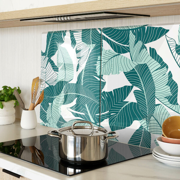 Tagliere in vetro con motivo di foglie tropicali nei toni del verde