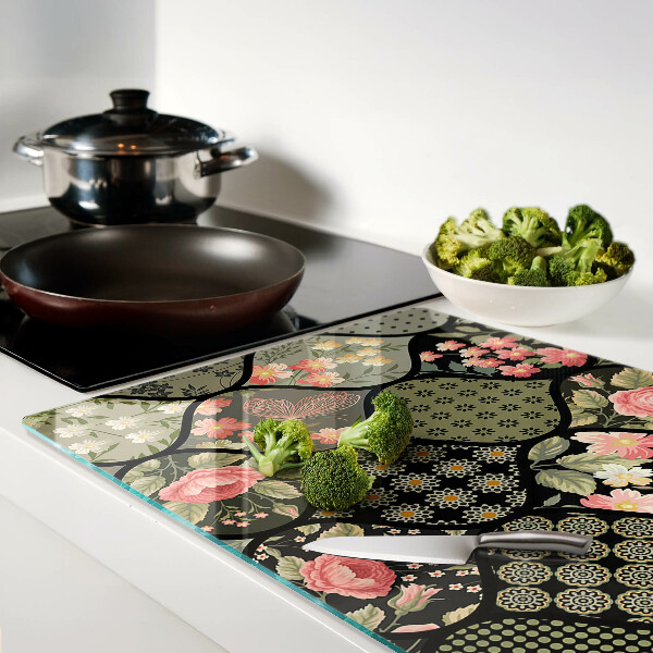 Tagliere in vetro temperato con motivo patchwork floreale e dettagli geometrici