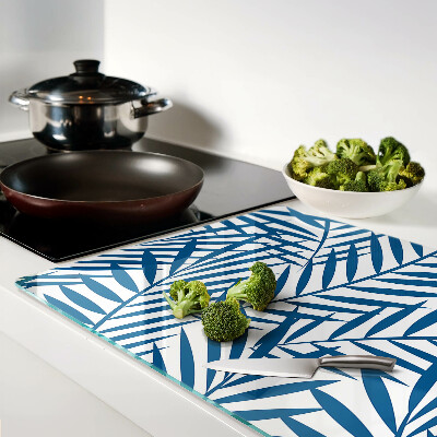 Tagliere in vetro con motivo di foglie di palma nei toni del blu