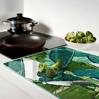 Tagliere in vetro con motivo di foglie di palma nei toni del verde