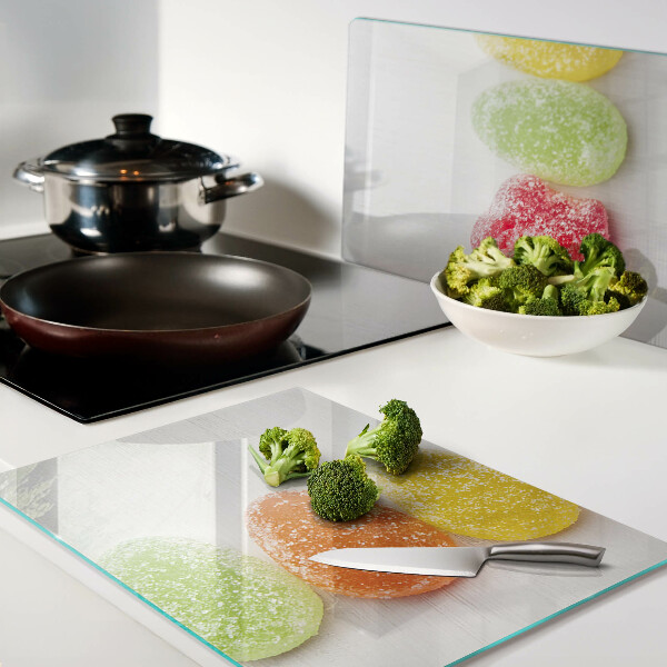 Tagliere in vetro temperato con decoro di dolci nei colori dell'arcobaleno