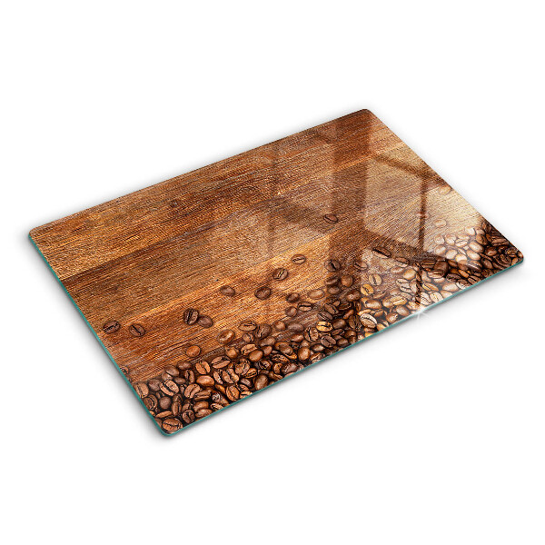 Tagliere in vetro temperato Chicchi di caffè su sfondo di legno
