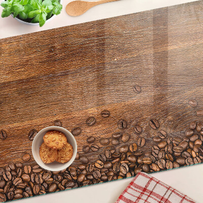 Tagliere in vetro temperato con stampa di chicchi di caffè su sfondo di legno