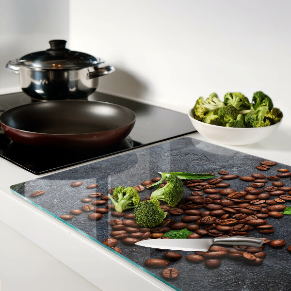 Tagliere in vetro con motivo di chicchi di caffè su sfondo effetto pietra