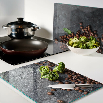 Tagliere in vetro con motivo di chicchi di caffè su sfondo effetto pietra