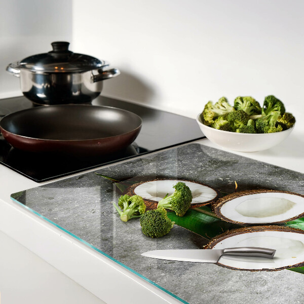 Tagliere in vetro temperato con motivo di cocco su sfondo effetto cemento