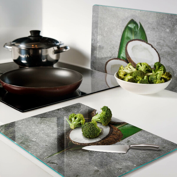 Tagliere in vetro temperato con motivo di cocco su sfondo effetto cemento