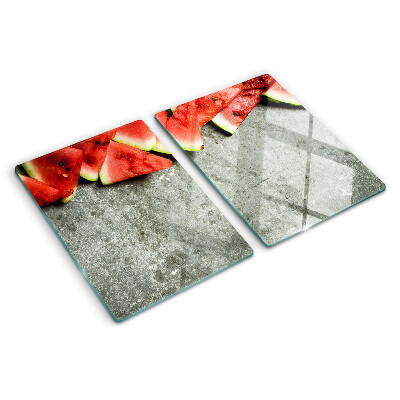 Tagliere in vetro temperato con decorazione a fette di anguria su sfondo grigio