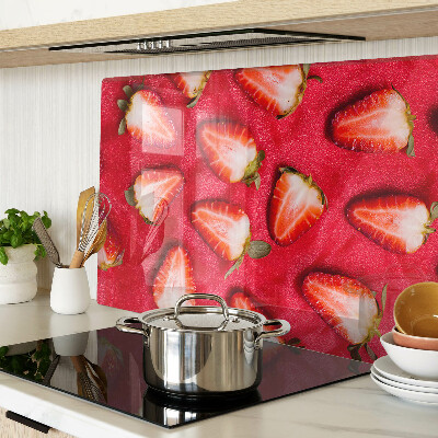 Tagliere in vetro temperato con decorazione di fragole su sfondo rosa