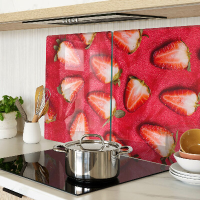 Tagliere in vetro temperato con decorazione di fragole su sfondo rosa