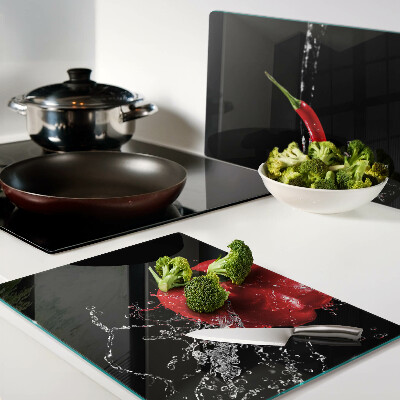 Tagliere in vetro temperato con stampa di peperone rosso immerso in acqua