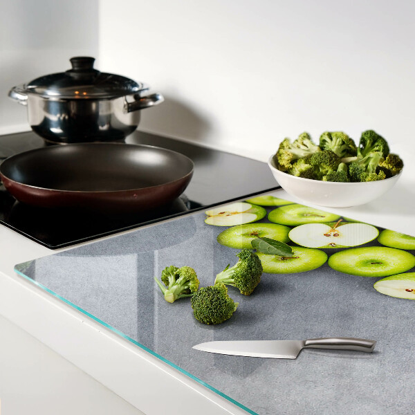 Tagliere in vetro temperato con stampa di mele verdi su sfondo grigio