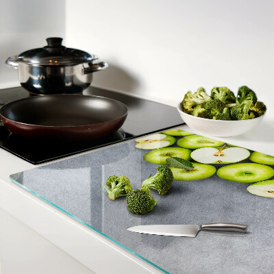 Tagliere in vetro temperato con stampa di mele verdi su sfondo grigio