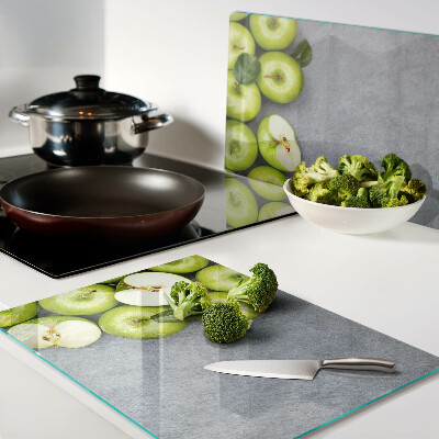 Tagliere in vetro temperato con stampa di mele verdi su sfondo grigio