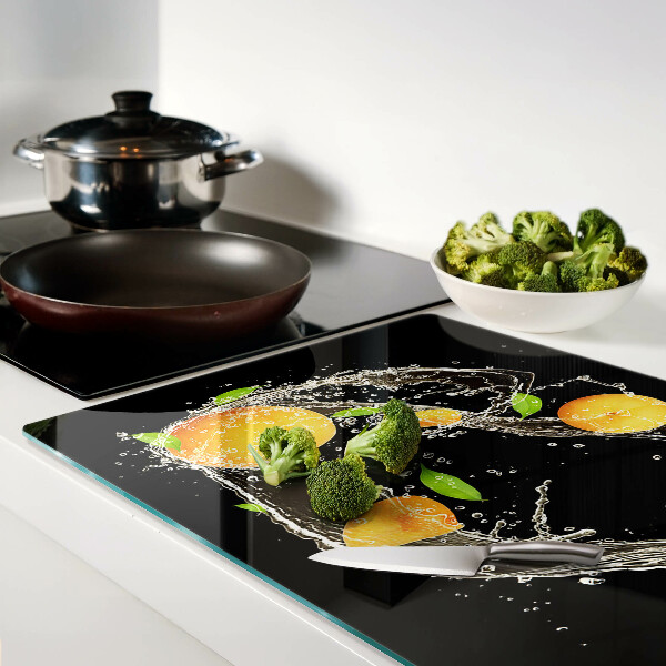 Tagliere in vetro con motivo agrumi immersi in acqua