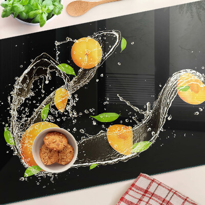 Tagliere in vetro con motivo agrumi immersi in acqua