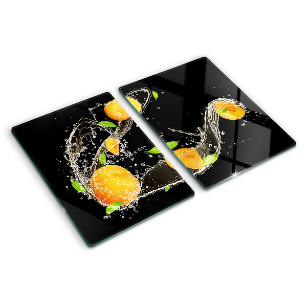 Tagliere in vetro con motivo agrumi immersi in acqua