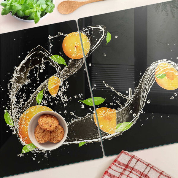 Tagliere in vetro con motivo agrumi immersi in acqua