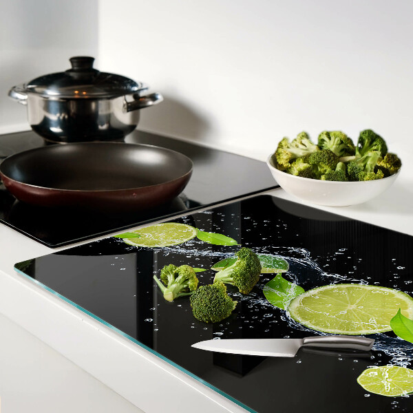 Tagliere in vetro temperato con stampa di limoni in acqua e foglie di menta