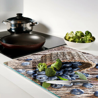 Tagliere in vetro temperato con motivo di mirtilli in un cesto