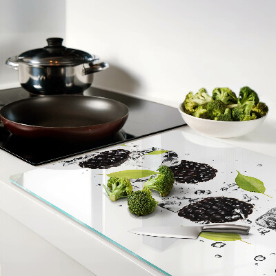 Tagliere in vetro temperato con stampa di lamponi con foglie e gocce d'acqua