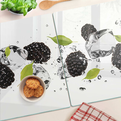 Tagliere in vetro temperato con stampa di lamponi con foglie e gocce d'acqua